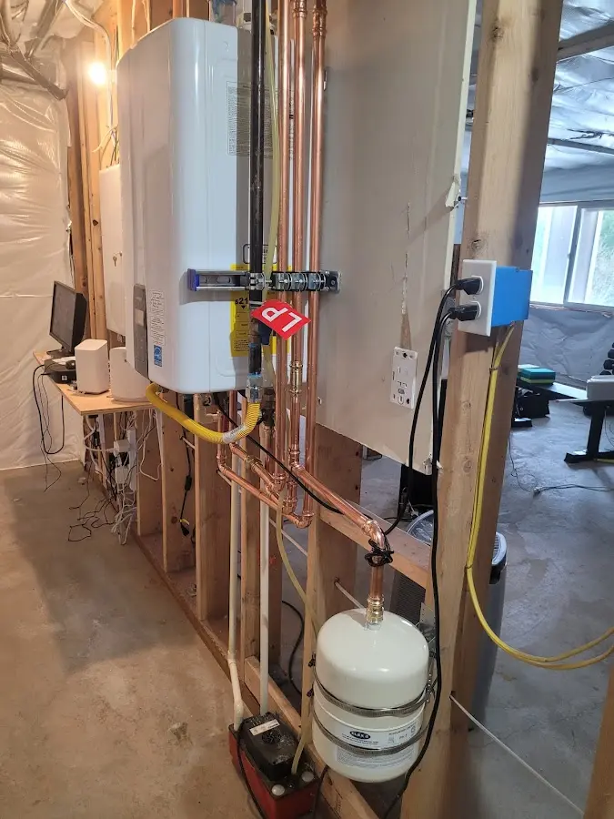 Licensed plumber repairing a kitchen sink in O'Fallon